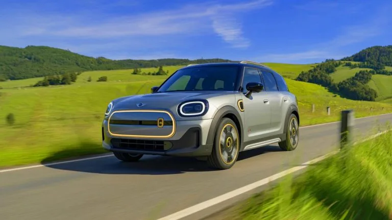 Illustration of the 2025 Mini Countryman EV in a scenic outdoor setting.
