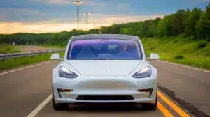 Illustration of Tesla vehicles on a highway, highlighting the interplay between advanced technology and driver behavior.