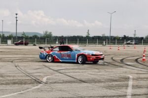 A vibrant drift car on a race track in Turkey, showcasing motorsport action.