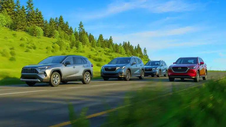 Illustration of the Toyota RAV4, Subaru Forester, and Mazda CX-50 hybrid compact SUVs.