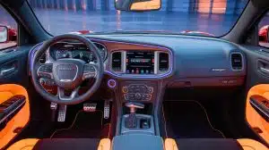 Illustration of the 2026 Dodge Charger Scat Pack interior showcasing advanced lighting and spacious design.