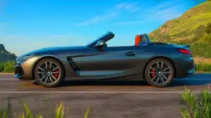 Illustration of the BMW Z4 Final Edition in Frozen Black metallic with red-accented interior elements.