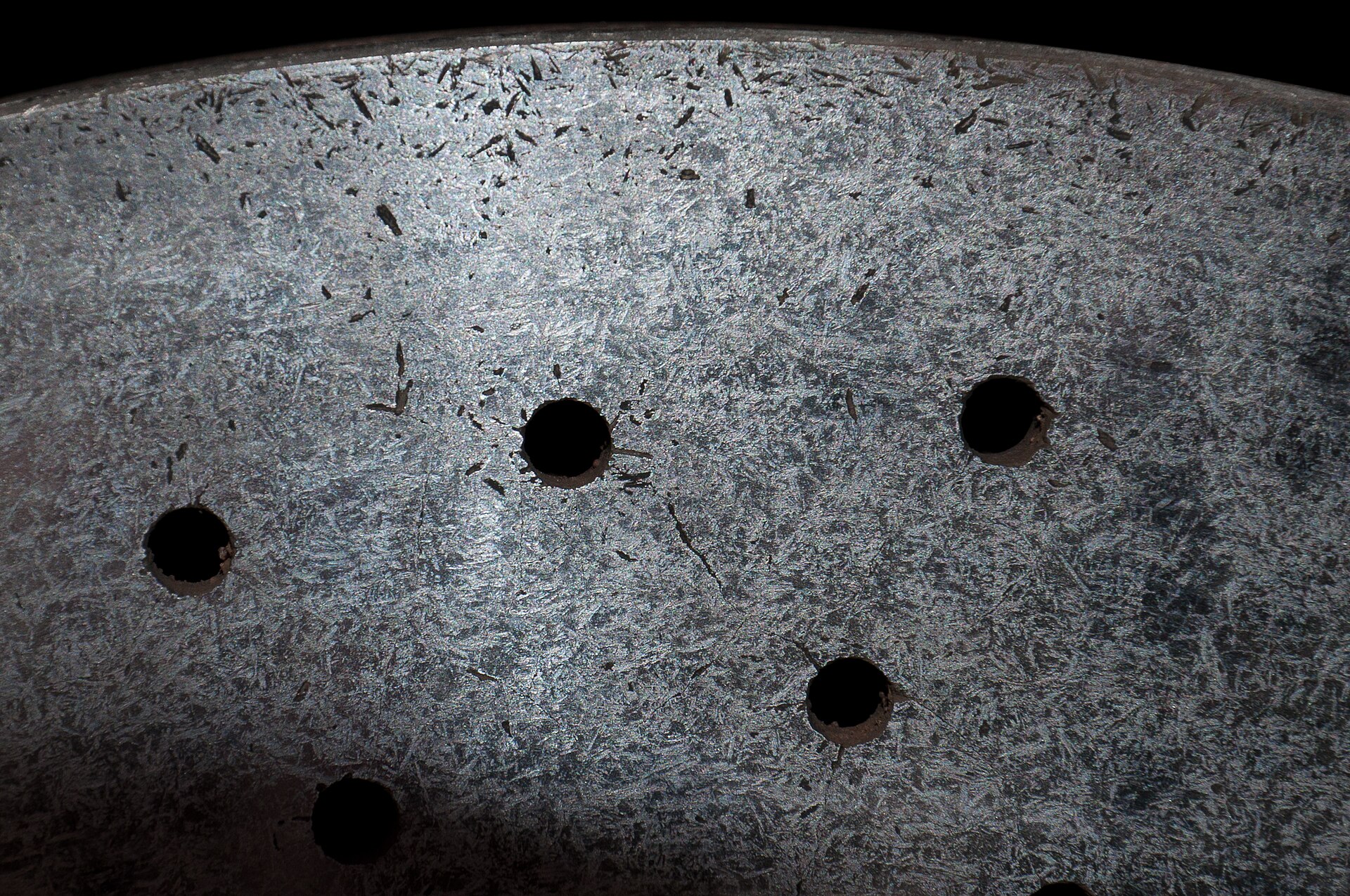 Close-up of the drilled surface of a carbon ceramic brake disc